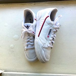 Authentic White leather Adidas with red and blue.